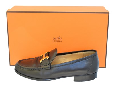 Lot 17 - A pair of Hermès black leather loafers