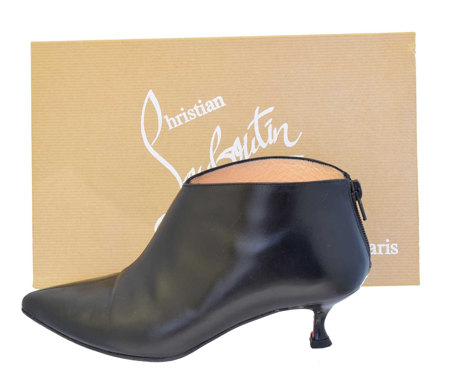 Lot 6 - A pair of Christian Louboutin black leather heeled ankle boots