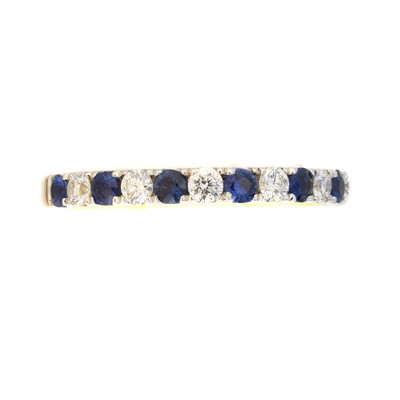 Lot 164 - An 18ct gold sapphire and diamond band ring
