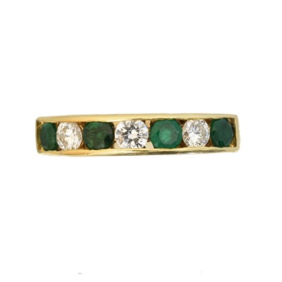 Lot 128 - An 18ct gold emerald and diamond band ring