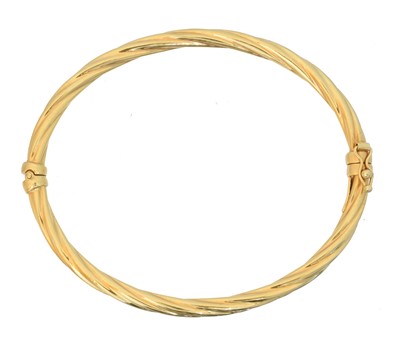 Lot 19 - A 9ct gold bangle by UnoAErre