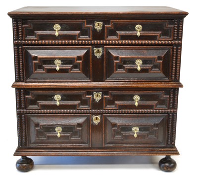 Lot A late 17th century oak geometric moulded chest of drawers.