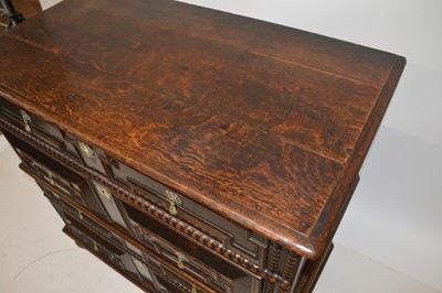Lot 269 - A late 17th century oak geometric moulded chest of drawers.