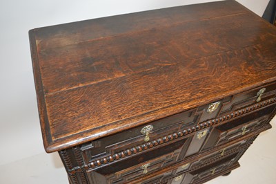 Lot 269 - A late 17th century oak geometric moulded chest of drawers.