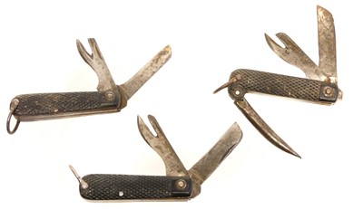 Lot 114 - Three army pocket knives.  Buyer must be over...