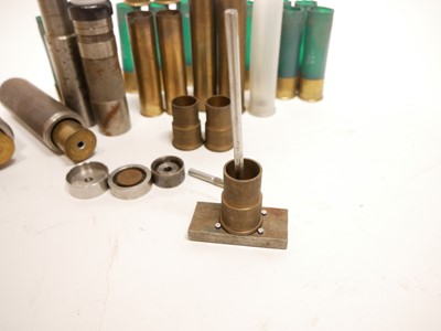 Lot 417 - Eight bore cartridges and tools, including two...