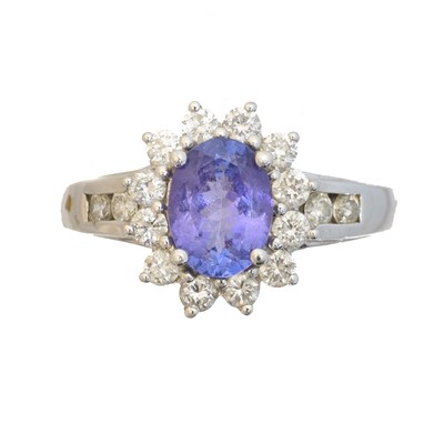 Lot 135 - A 14ct gold tanzanite and diamond cluster ring