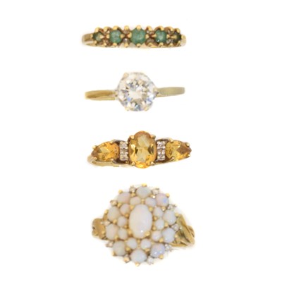 Lot 99 - Four gold gem set dress rings