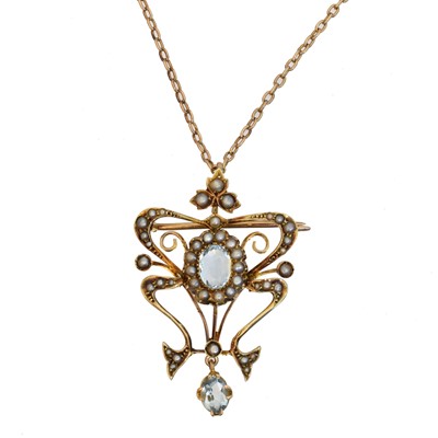 Lot 59 - An early 20th century blue topaz and split pearl pendant