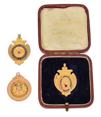 Lot 149 - Three early 20th century 9ct gold enamel football medallions
