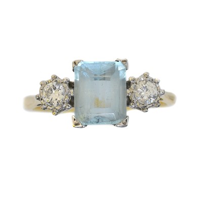 Lot 137 - An aquamarine and diamond three stone ring.