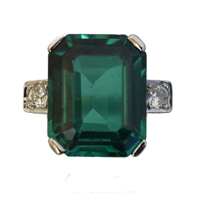 Lot 79 - A green paste and diamond three stone ring