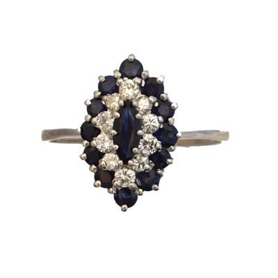 Lot 141 - An 18ct gold sapphire and diamond cluster ring