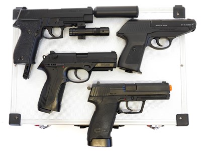 Lot 135 - Four CO2 air pistols with five storage cases,...