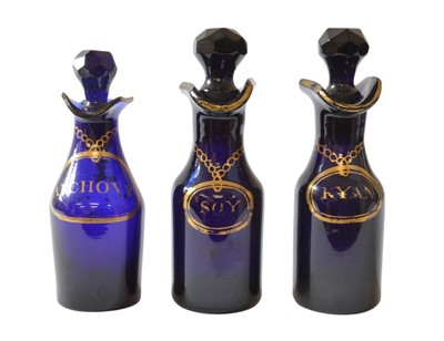 Lot 189 - Three 19th Century Bristol Blue Glass Sauce or Condiment Bottles