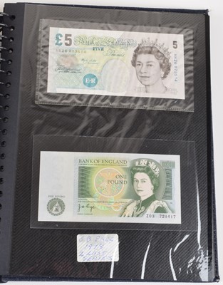Lot 95 - Twenty-five Bank of England banknotes in an album (25).