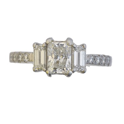 Lot 128 - A platinum diamond dress ring.