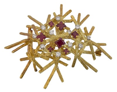 Lot A 1970s ruby and diamond brooch by George Weil.