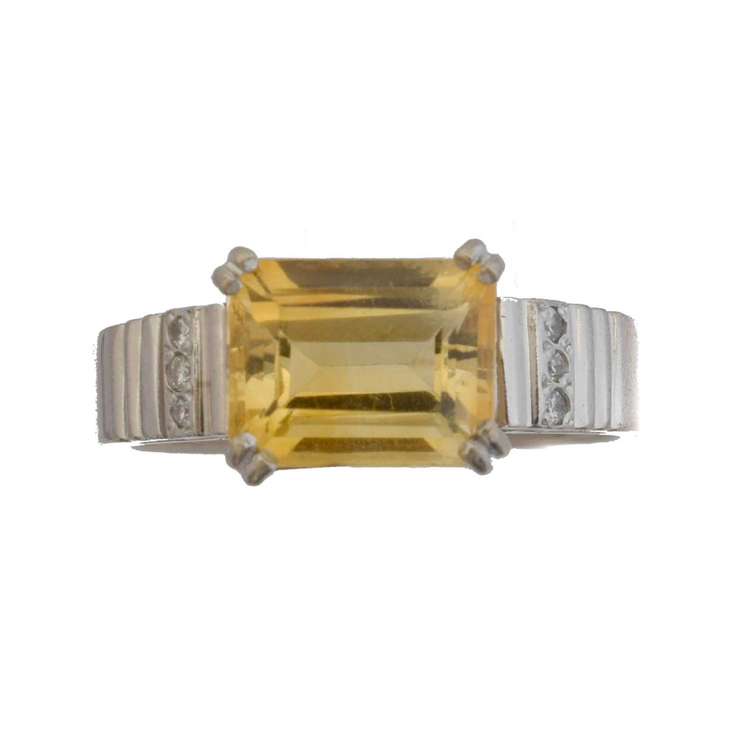 Lot 114 - A citrine and diamond dress ring by Chimento.
