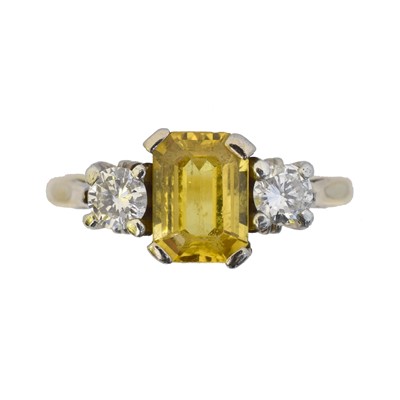Lot 119 - An 18ct gold sapphire and diamond three stone ring.