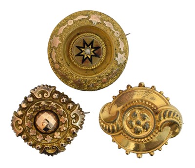 Lot 6 - Three Victorian gilt and yellow metal brooches.