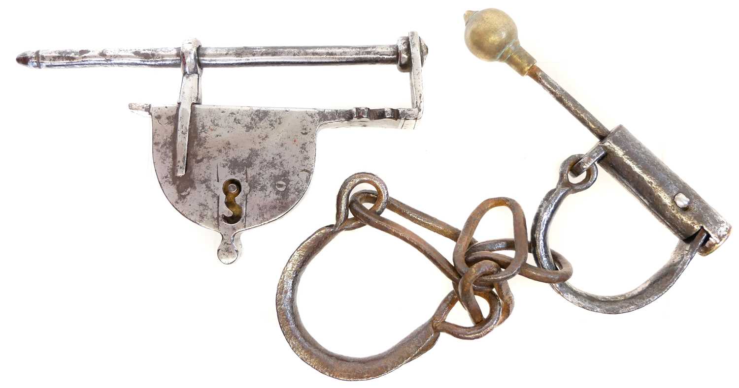 Lot 240 - Pair of hand cuffs and a bar lock (lacking the...
