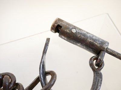 Lot 240 - Pair of hand cuffs and a bar lock (lacking the...