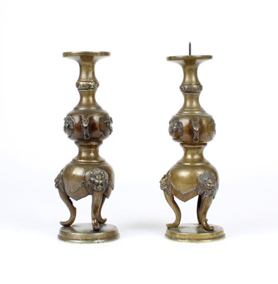 Lot 12 - A Pair of Chinese Bronze Twin-Handled Pricket Candlesticks