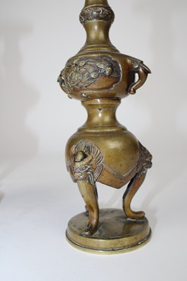 Lot 12 - A Pair of Chinese Bronze Twin-Handled Pricket Candlesticks