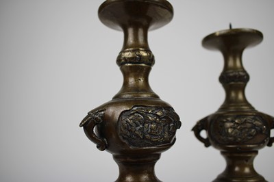 Lot 12 - A Pair of Chinese Bronze Twin-Handled Pricket Candlesticks