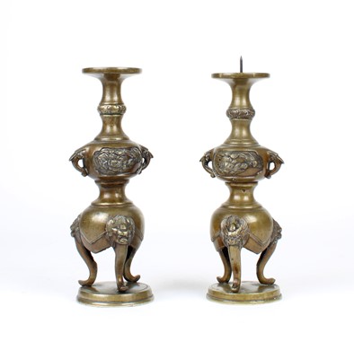 Lot 12 - A Pair of Chinese Bronze Twin-Handled Pricket Candlesticks