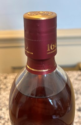 Lot 56 - 1 bottle in Original Packaging and protective sleeve Bushmills