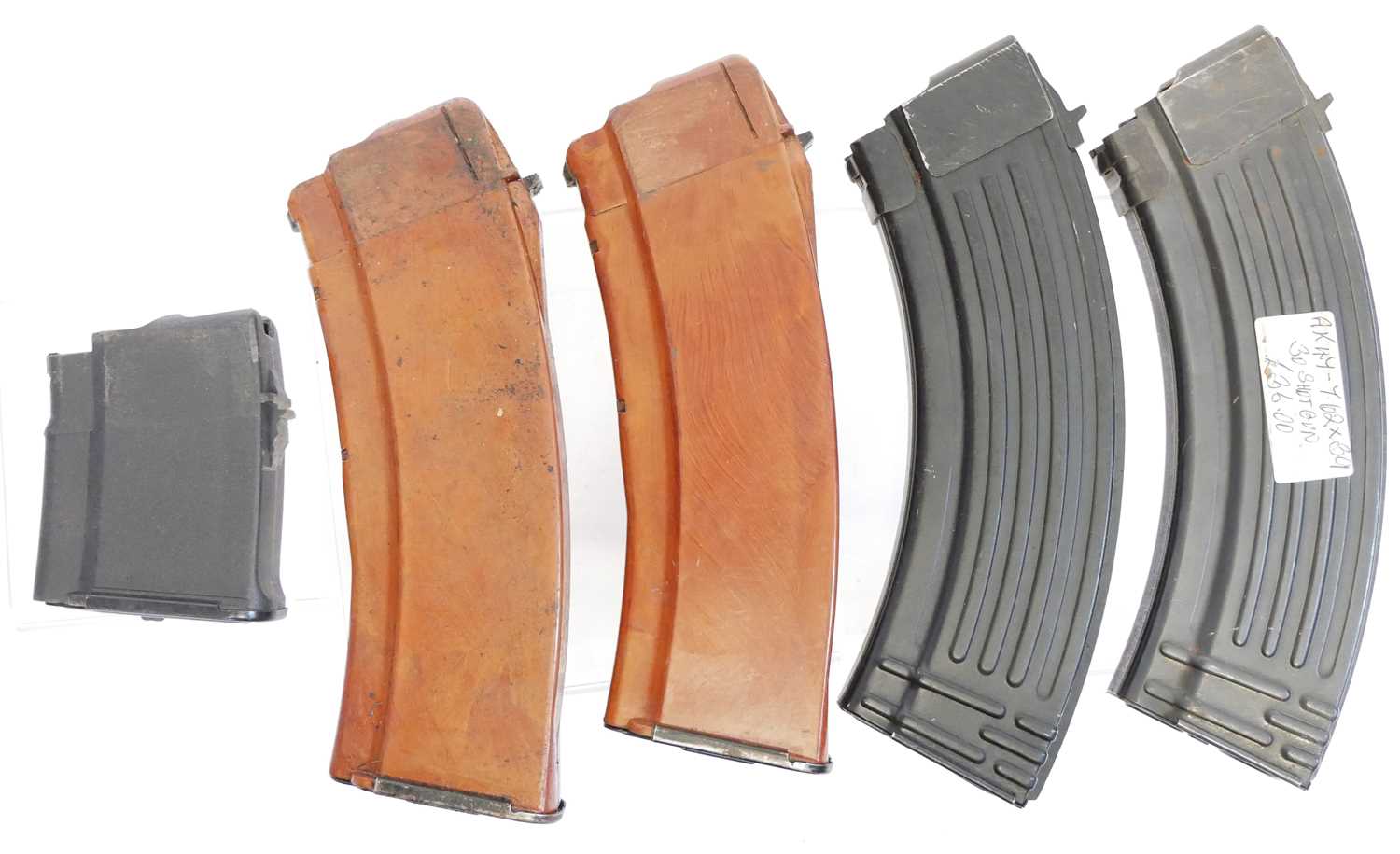 Lot 448 - Five AK magazines, including two Bakelite AK74...