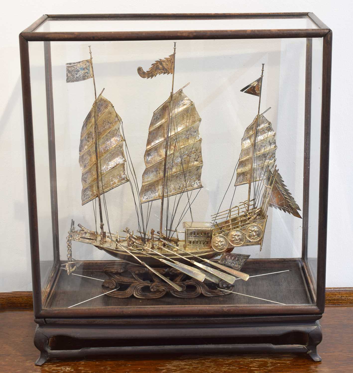 Lot 45 - A Chinese white metal model of a ship.