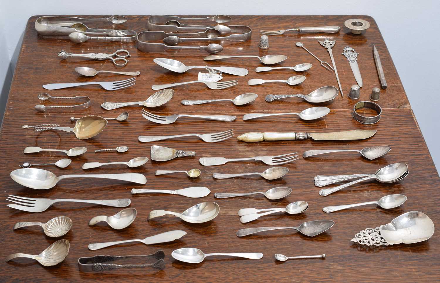 Lot 20 - A selection of assorted silver and white metal flatware.