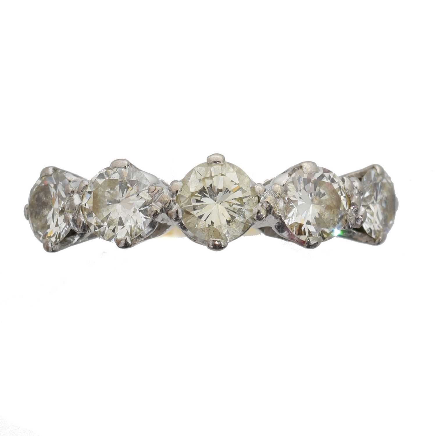 Lot 135 - A diamond five stone ring.