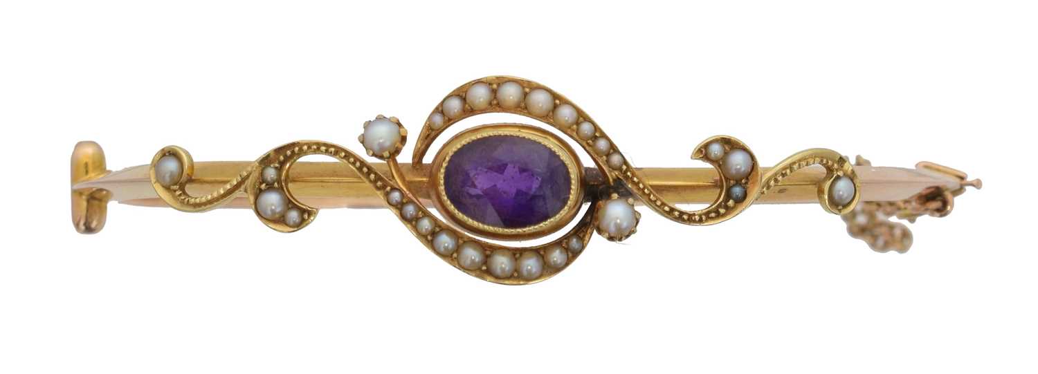 Lot 24 - An early 20th century amethyst and split pearl hinged bangle.