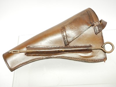 Lot 398 - British service revolver holster and cleaning...