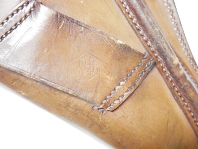 Lot 398 - British service revolver holster and cleaning...