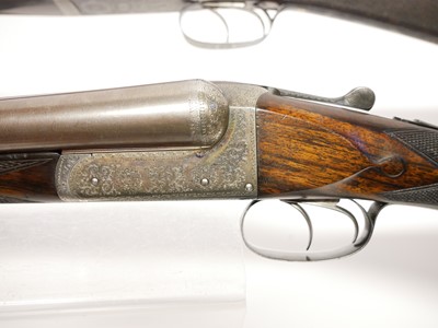 Lot 307 - Trulock and Harriss cased pair of 12 bore side...