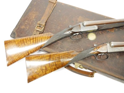 Lot 307 - Trulock and Harriss cased pair of 12 bore side...