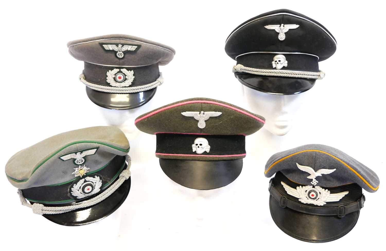 Lot 208 - Five reproduction German Third Reich peaked caps.