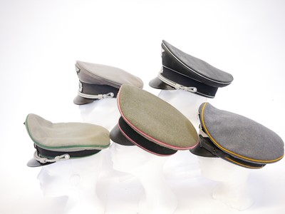 Lot 208 - Five reproduction German Third Reich peaked caps.