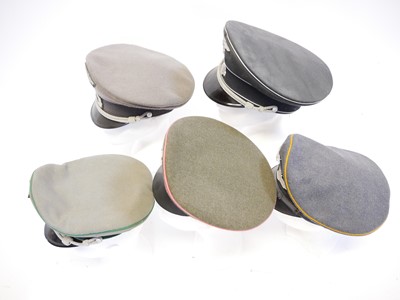 Lot 208 - Five reproduction German Third Reich peaked caps.