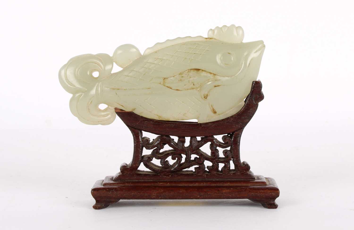 Lot 17 - A Chinese Carved Celadon Jade Fish