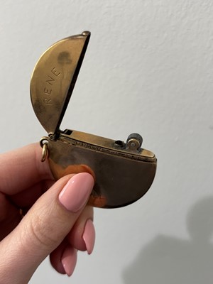 Lot 83 - A 9ct gold lighter.
