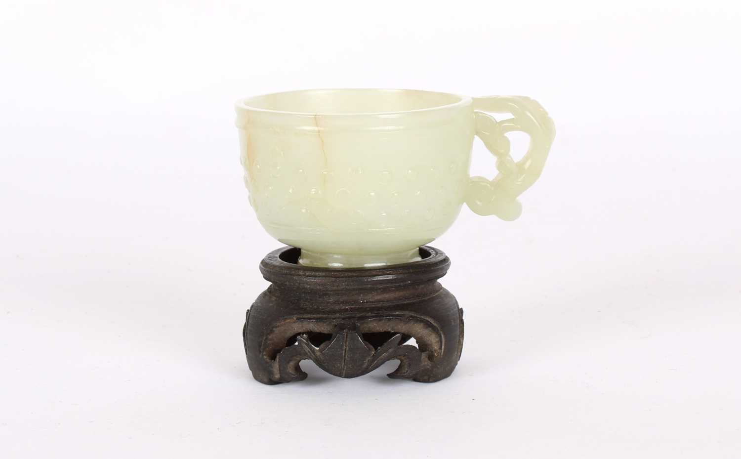 Lot 17 - A Small Chinese Ming Dynasty Carved Celadon Jade Cup