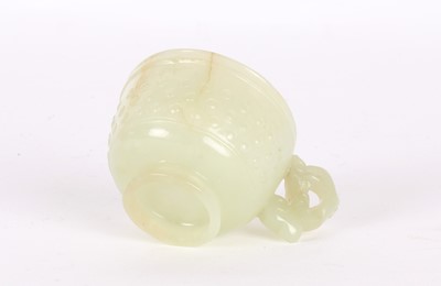 Lot 17 - A Small Chinese Ming Dynasty Carved Celadon Jade Cup
