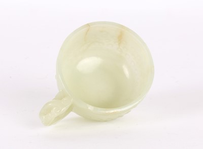 Lot 17 - A Small Chinese Ming Dynasty Carved Celadon Jade Cup