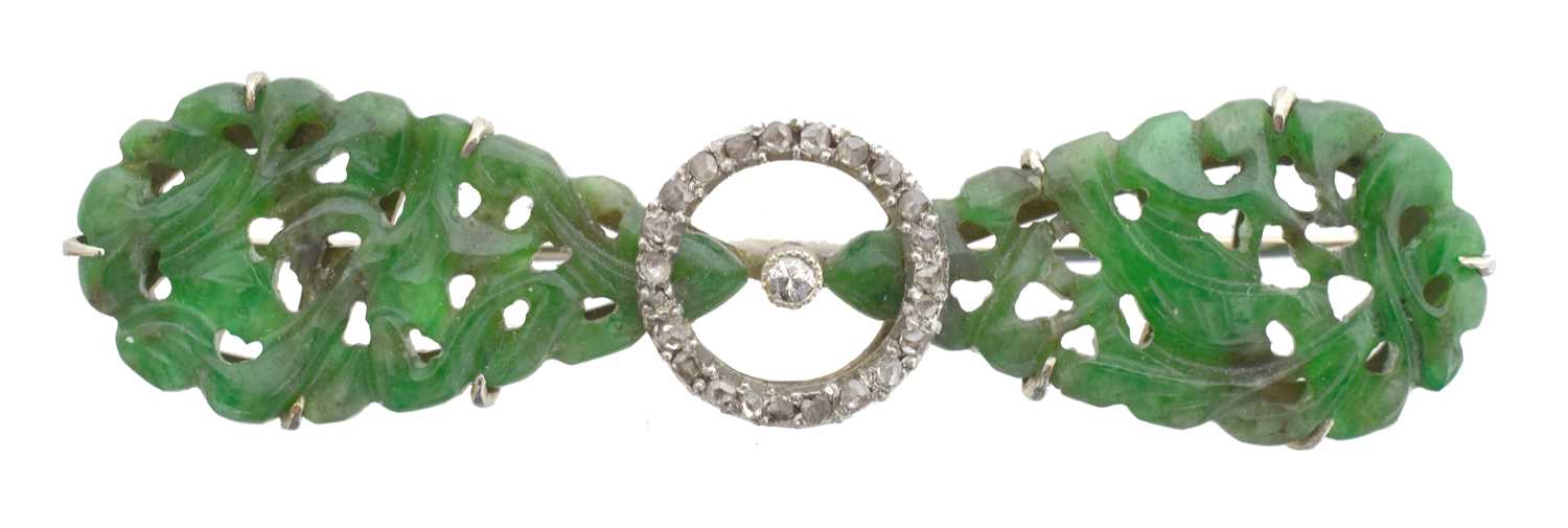 Lot 4 - A jade and diamond brooch.